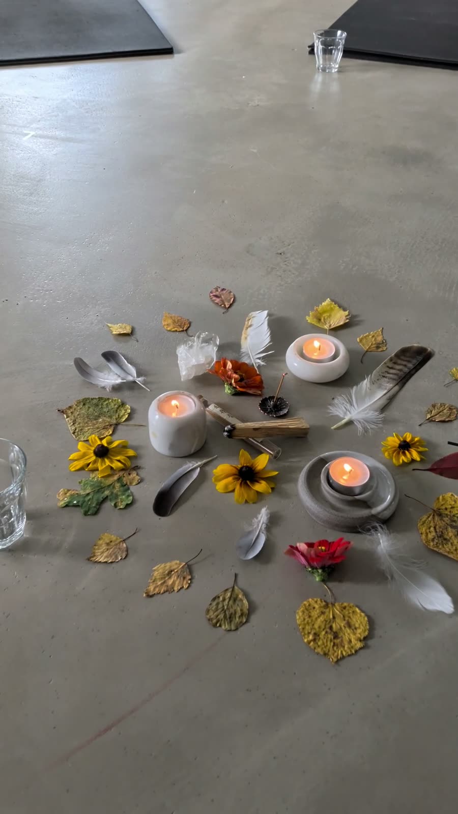 The autumn altar of candles, leaves and flowers