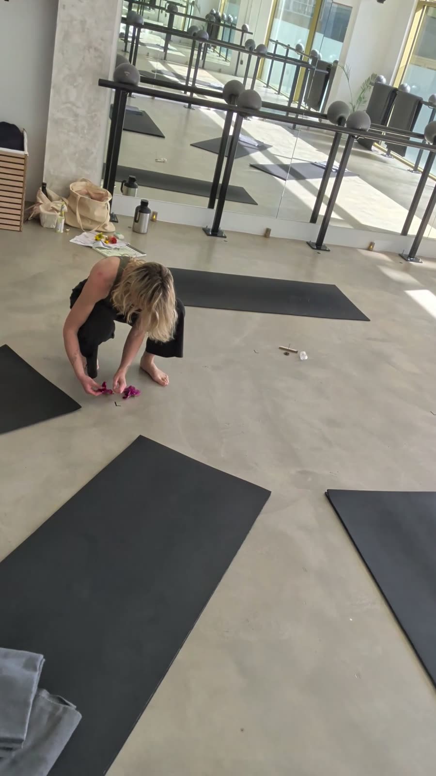 Nadia laying out the mats before the circle